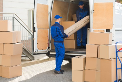 Team member loading furniture safely into a van