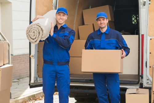 Loading furniture into a moving van near Archway