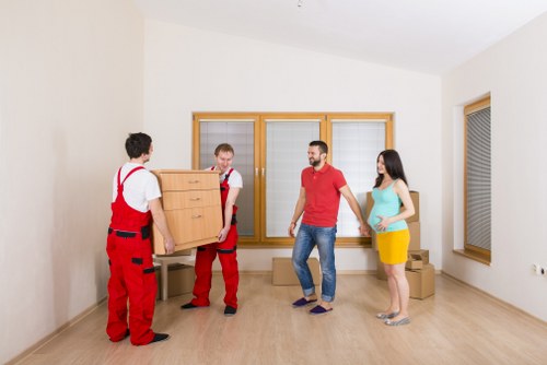 Worker checking lifting technique during a move