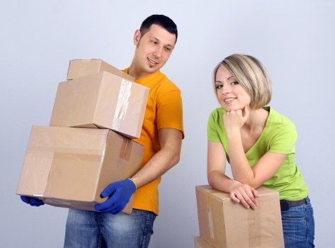 Careful unloading of furniture and boxes at a home in Archway