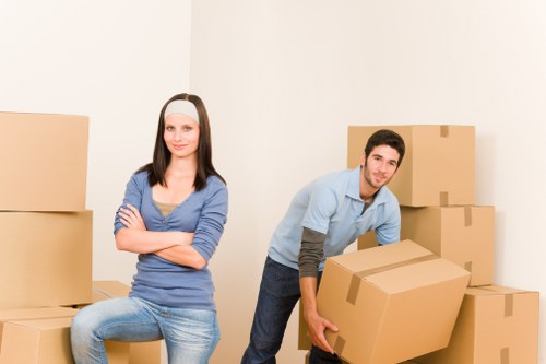 Packed moving boxes and furniture ready for house removals in Archway